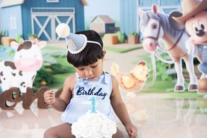 A collection of birthday party photos showing decorations, cake, and celebrations with a white and blue color theme.