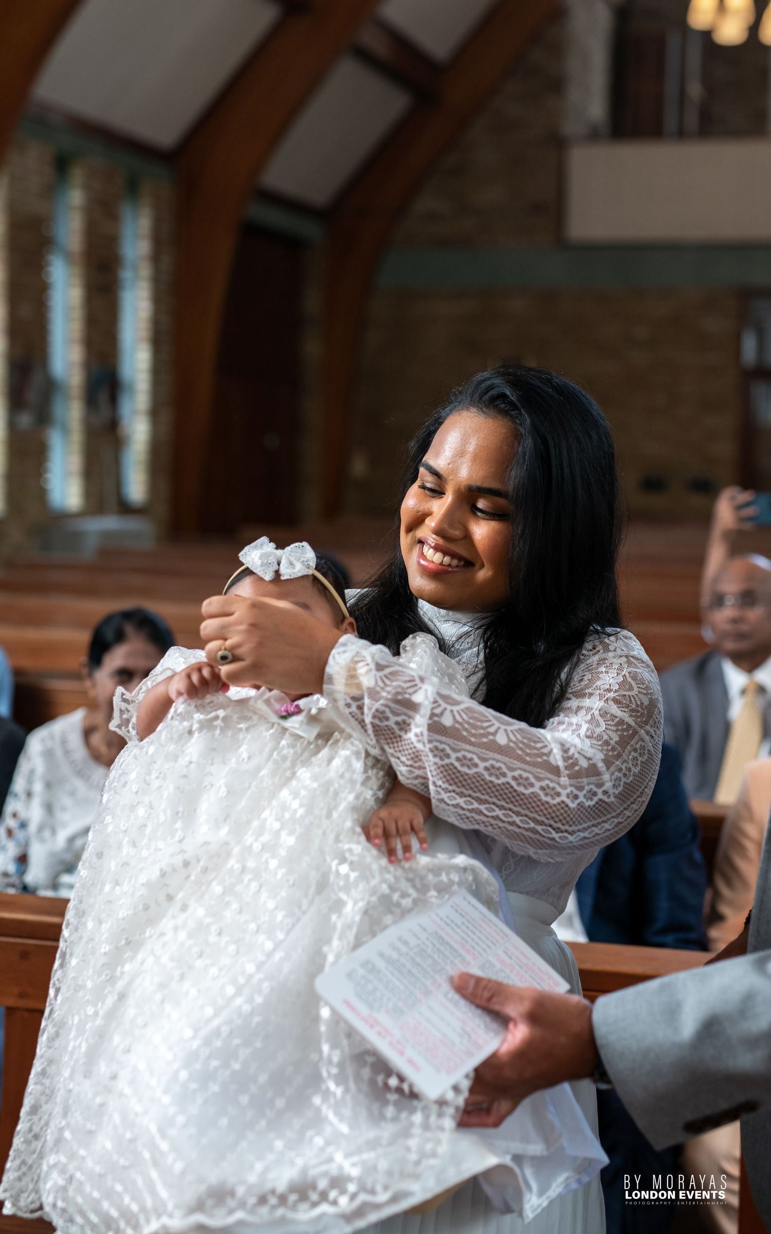 Joyful celebration sequence in church with white lace details.