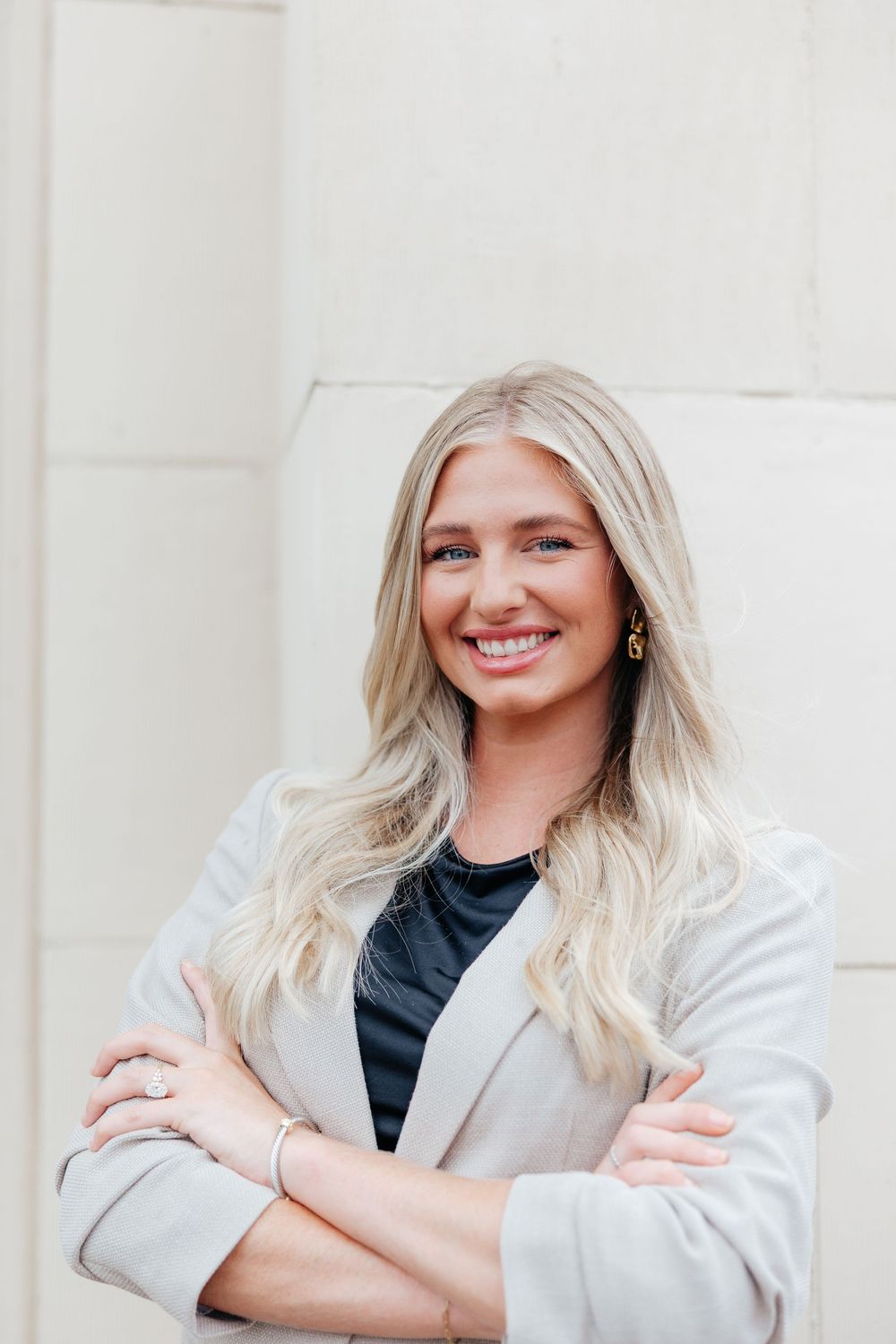 Professional headshot collage of someone with blonde hair wearing a white blazer and black top against a light background.