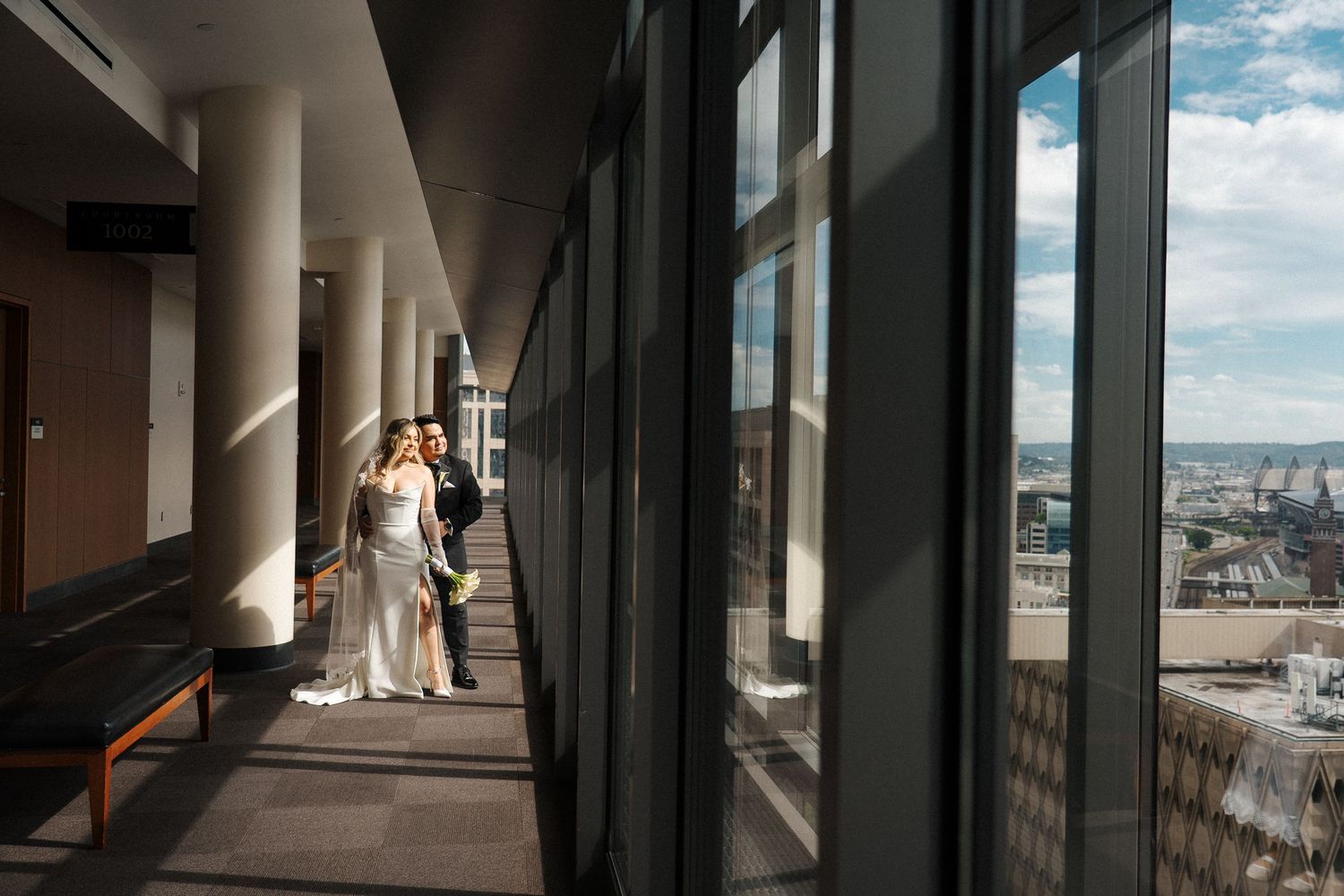 A vertical panoramic sequence of five frames showing light and shadows in a modern architectural hallway or corridor.