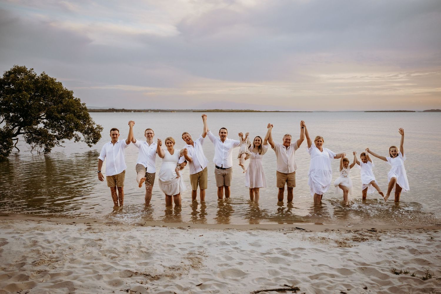 A scenic beach photo collage shows several groups of people enjoying the water and sand at sunset.