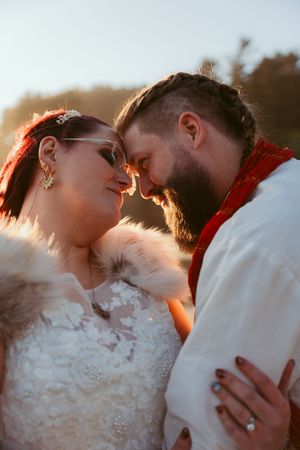 Romantic sunset wedding photo sequence showing tender close-up moments between a couple.