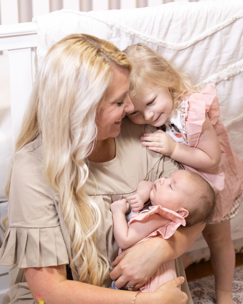 Tender family interaction captured in soft natural light.