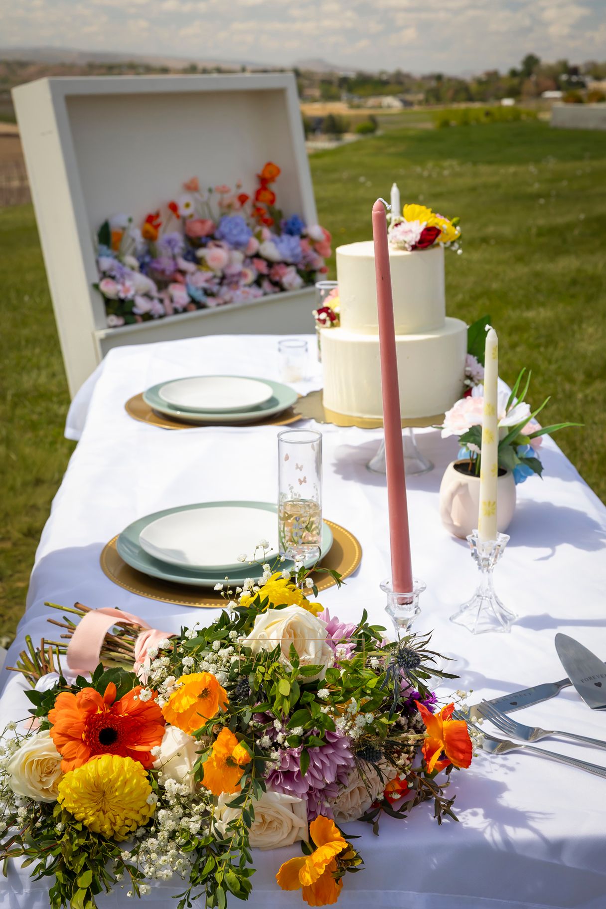 spring colored floral display in white box