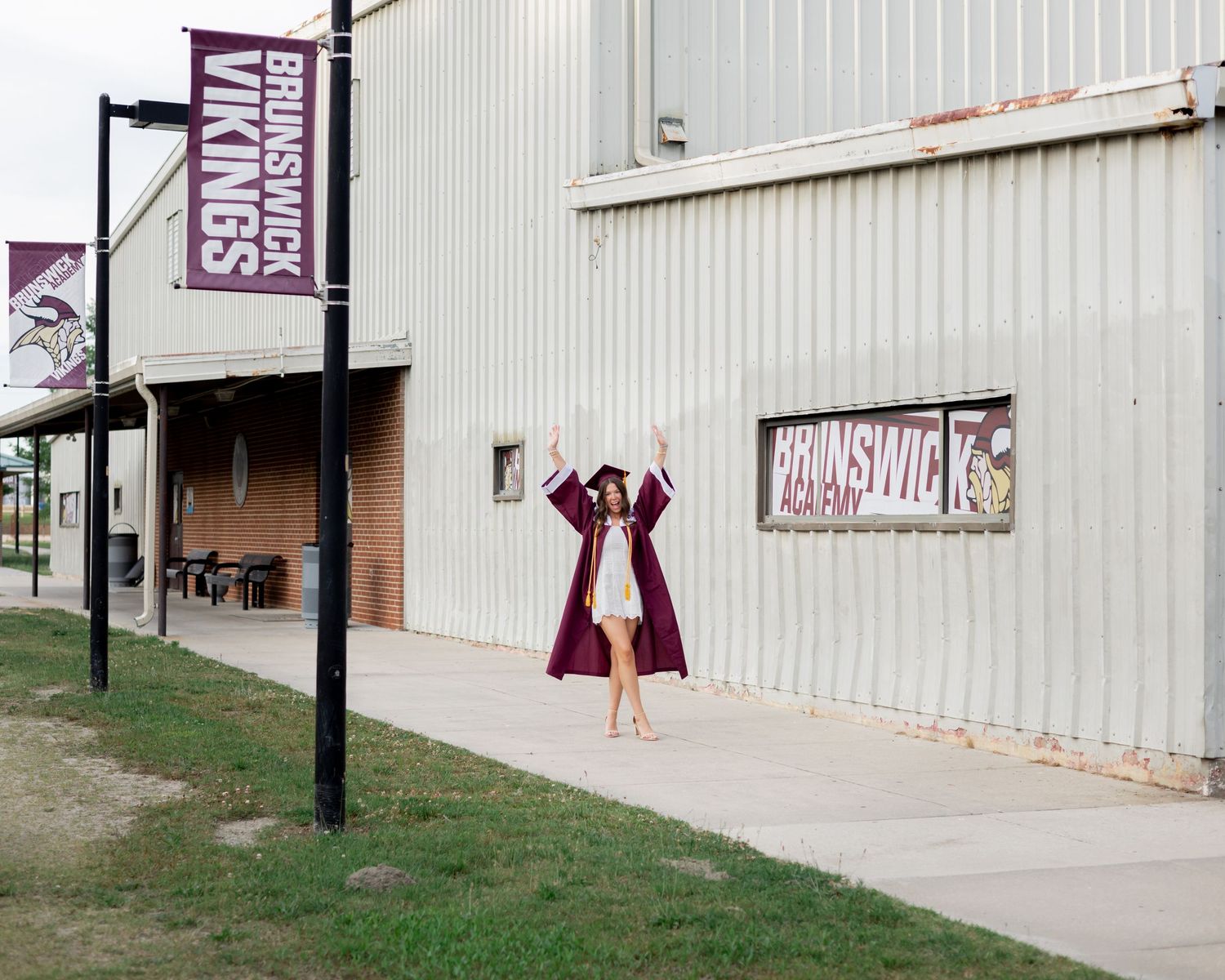 Series of graduation photos taken outside a school building with maroon accents.