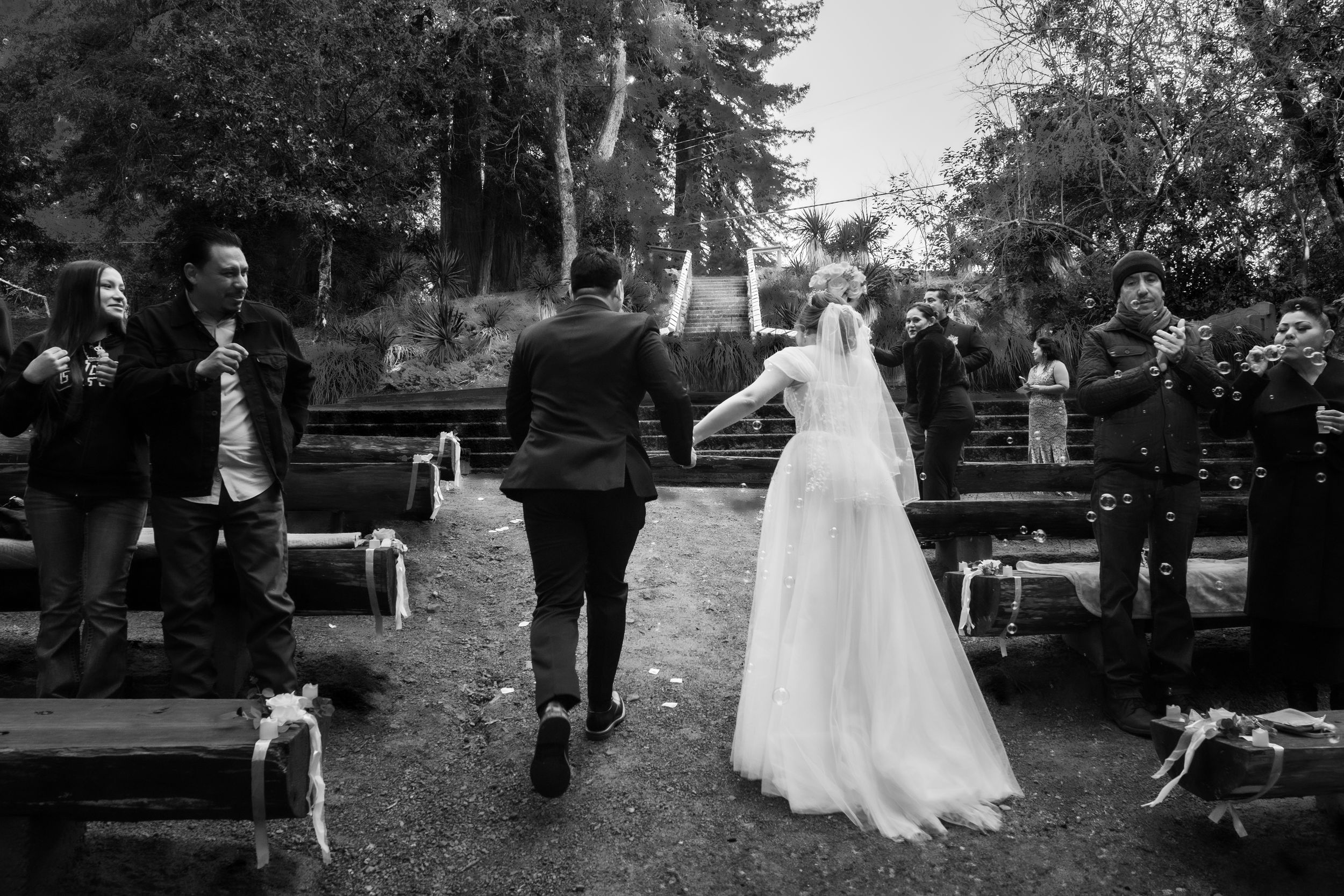 Couple walking down the aisle.