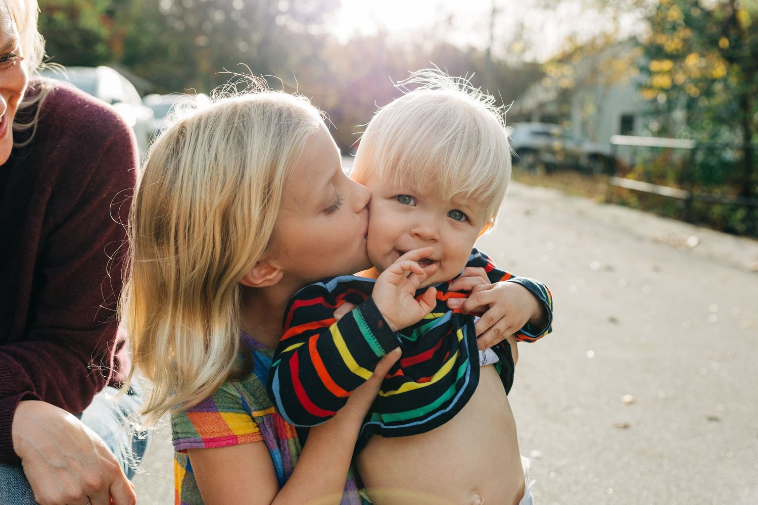 A sweet collection of candid outdoor family moments captured in warm sunlight during autumn in Charlotte, NC