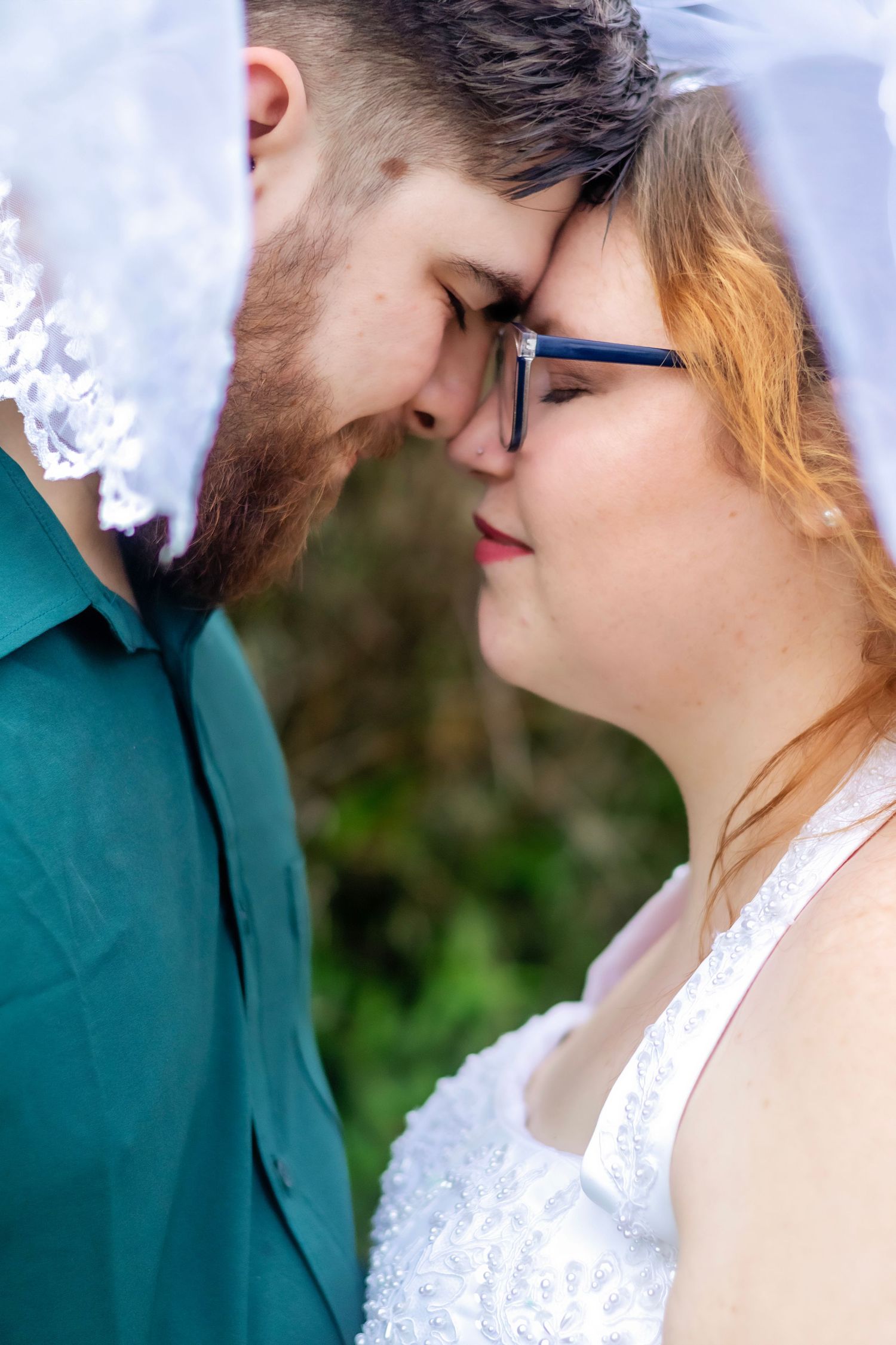 Intimate close-up sequence showing a romantic moment against a light background.