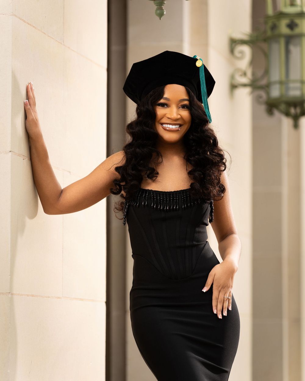 Elegant poses in formal attire against white classical columns and architecture.