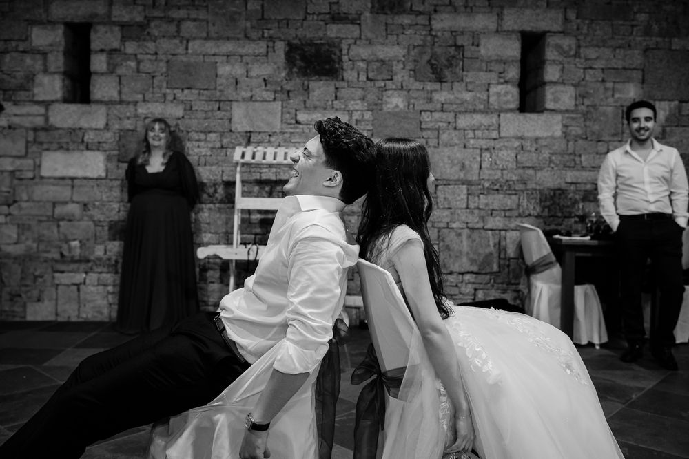 Black and white photo of wedding reception dance floor moments.