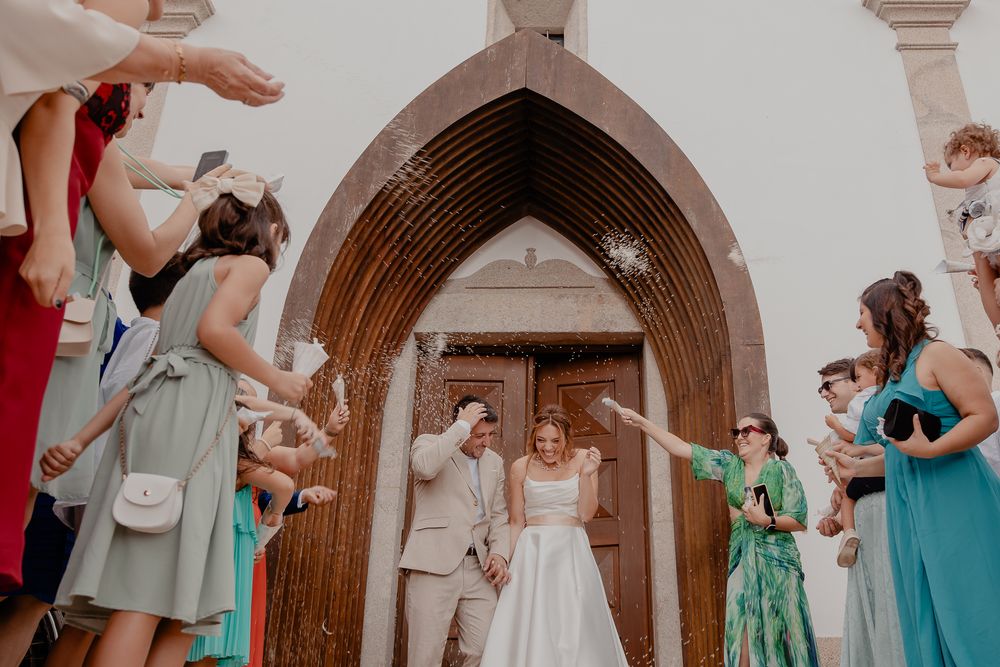 Wedding ceremony in progress inside a beautiful church with gothic arches.