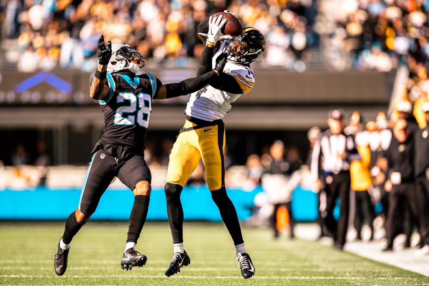 Pittsburgh Steelers receiver leaps to catch pass over Carolina Panthers defender 28.