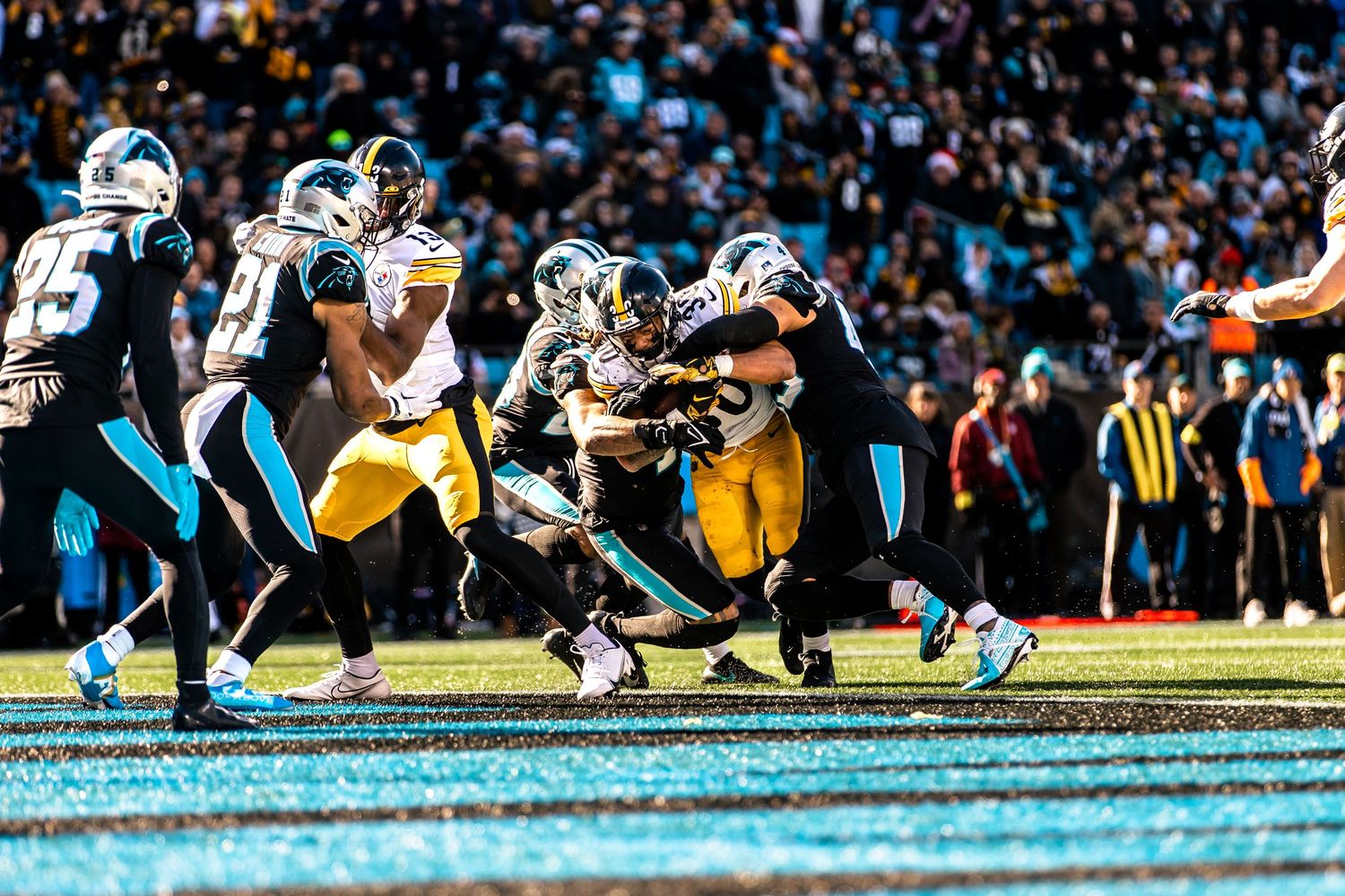 Pittsburgh Steelers running back pushes through Carolina Panthers defense for a score.