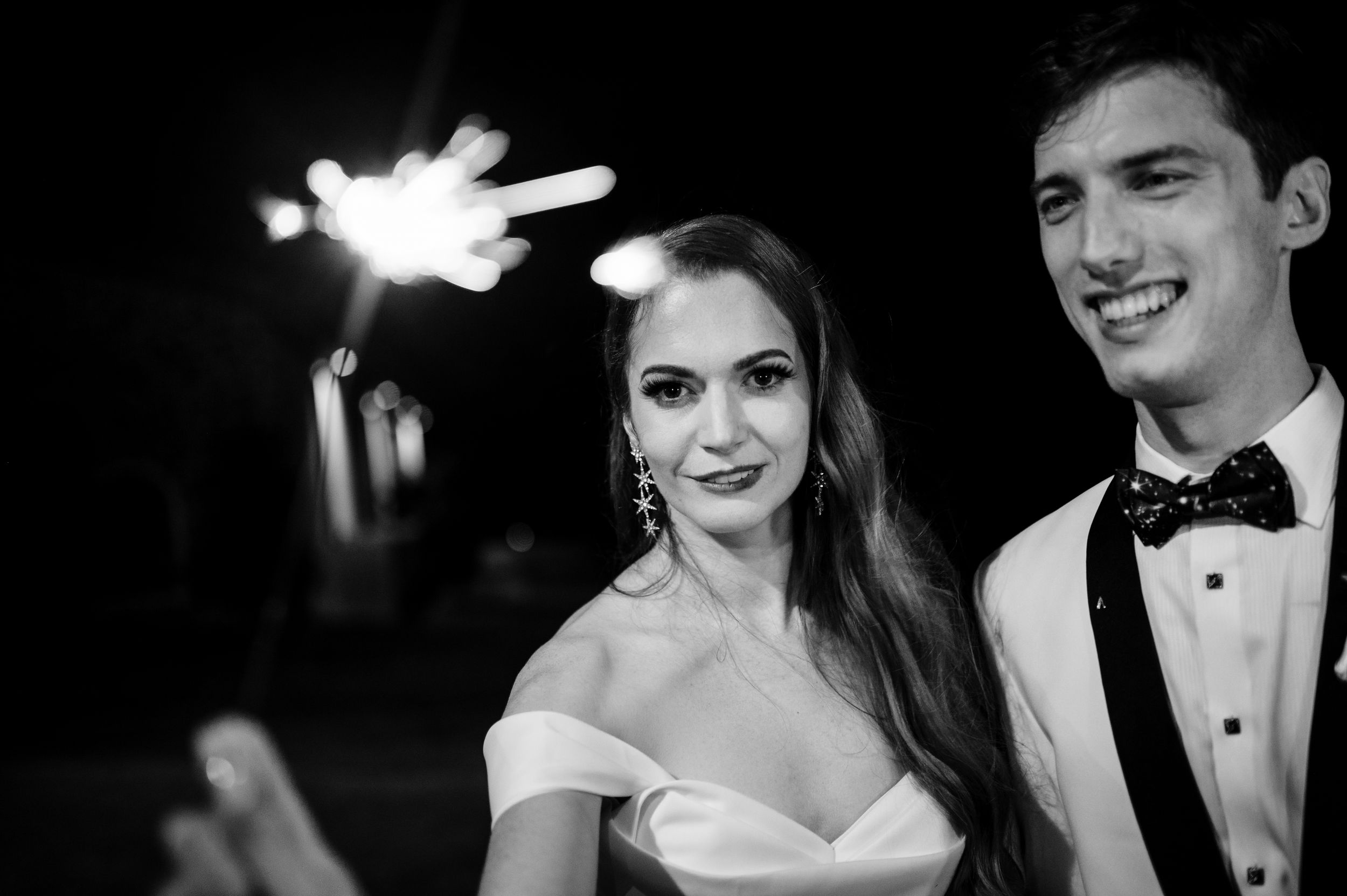 Black and white photographs of couples in formal attire at a wedding celebration.