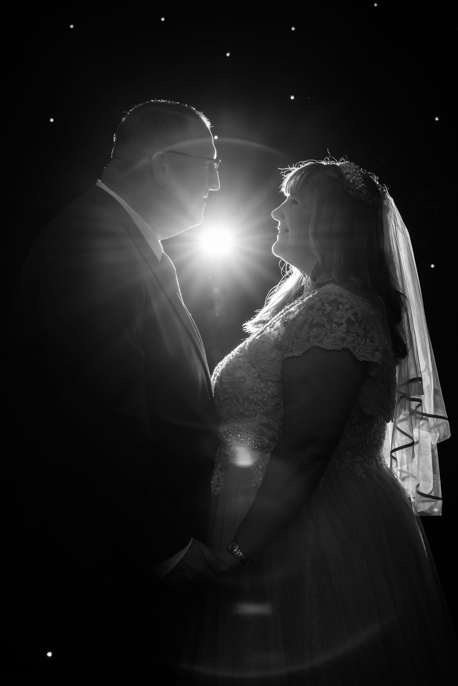 black and white off camera flash image against a starry background, wedding reception photography at Heath Plaza by Michael Pardoe, Cheshire