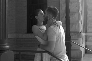 A romantic sequence of black and white photographs showing affectionate embraces.