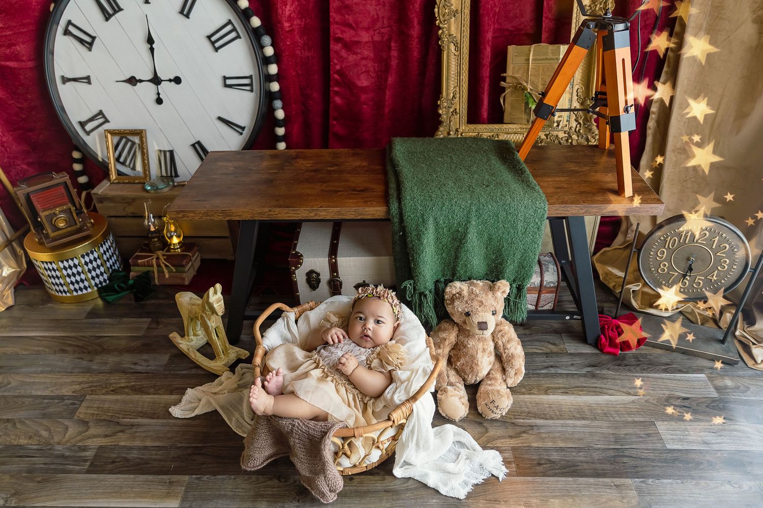 baby girl in basket with teddy bear