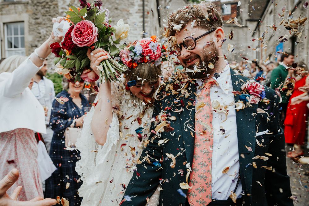 Colourful petal confetti shower during Emily and Jamie’s Silk Mill wedding