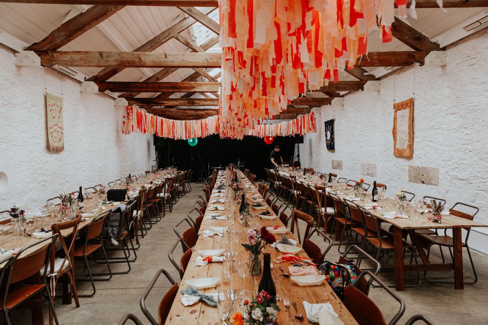 Personalised fabric panels decorating the Silk Mill barn for the wedding.