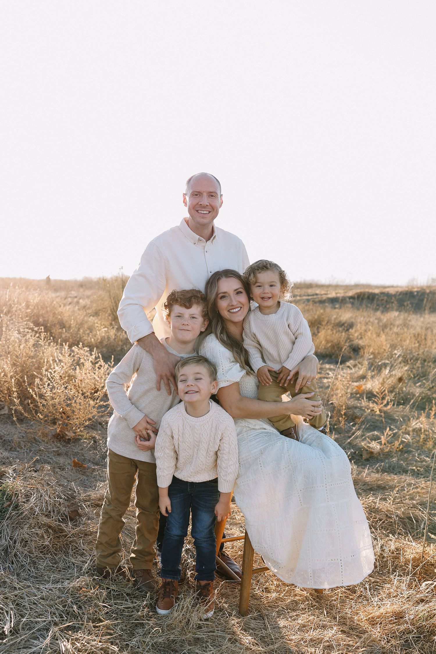 Golden hour family session in Orange County with warm sunlight and natural smiles