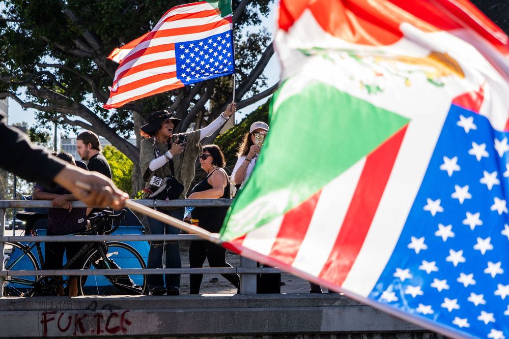 Demonstrators wave flags during the “No Kings” protest in Los Angeles, California in October 2025.