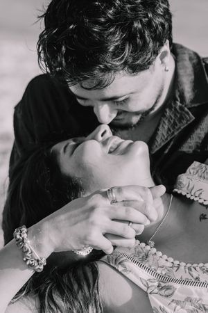 Black and white intimate moment captured between a couple.
