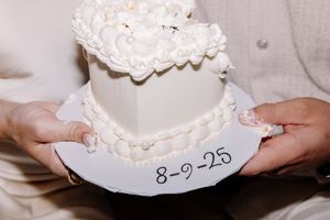 Delicate white seashells arranged with a date inscription reading 8-9-20.