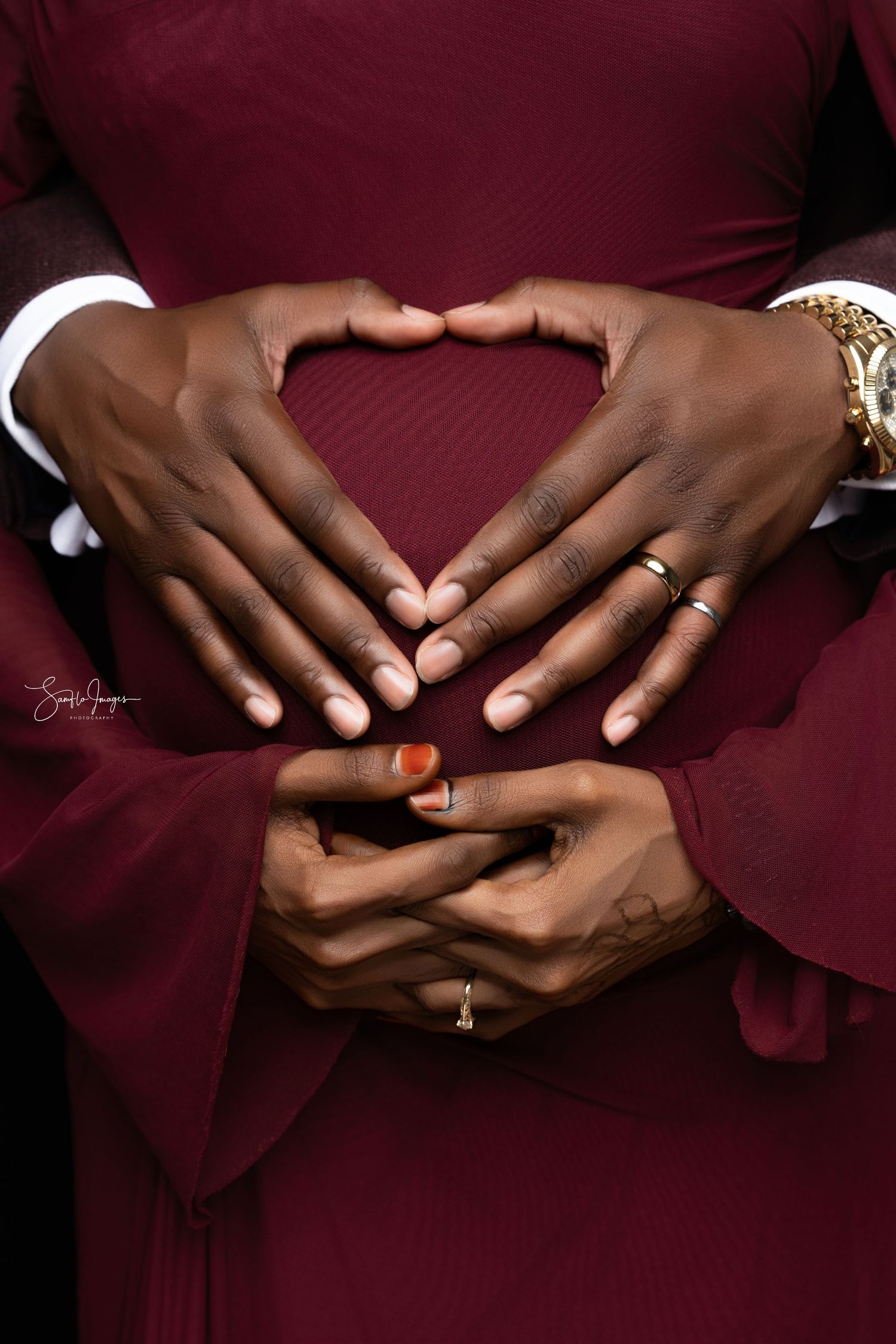 Close-up shots of hands wearing burgundy attire showing engagement ring details against dark red background.