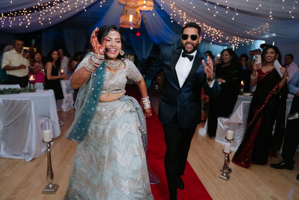 Wedding reception venue decorated with twinkling lights and guests dancing on the dance floor.