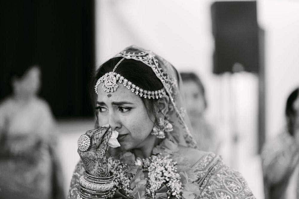 Black and white wedding photography showcasing traditional Indian bridal details.