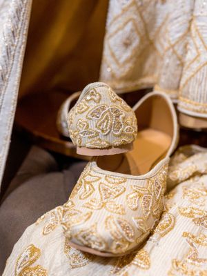 Elegant bridal shoes with intricate gold and white detailing displayed in sequence.