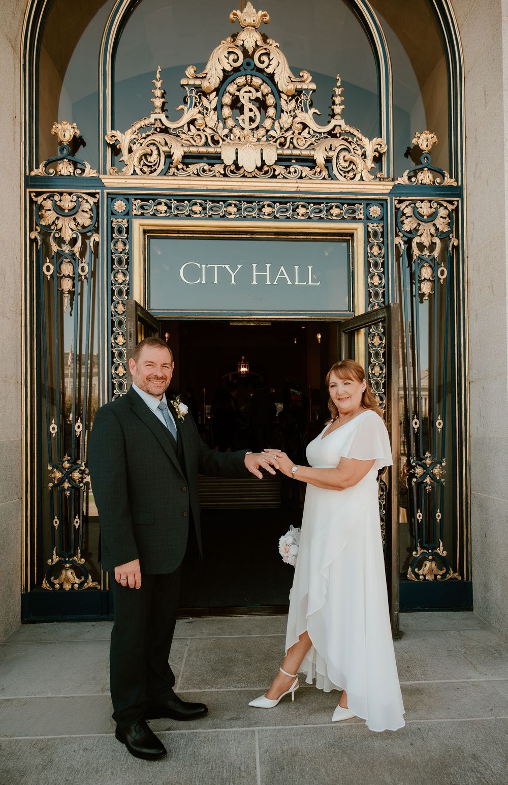 A series of wedding photos showing a couple posing in front of ornate City Hall entrance doors.