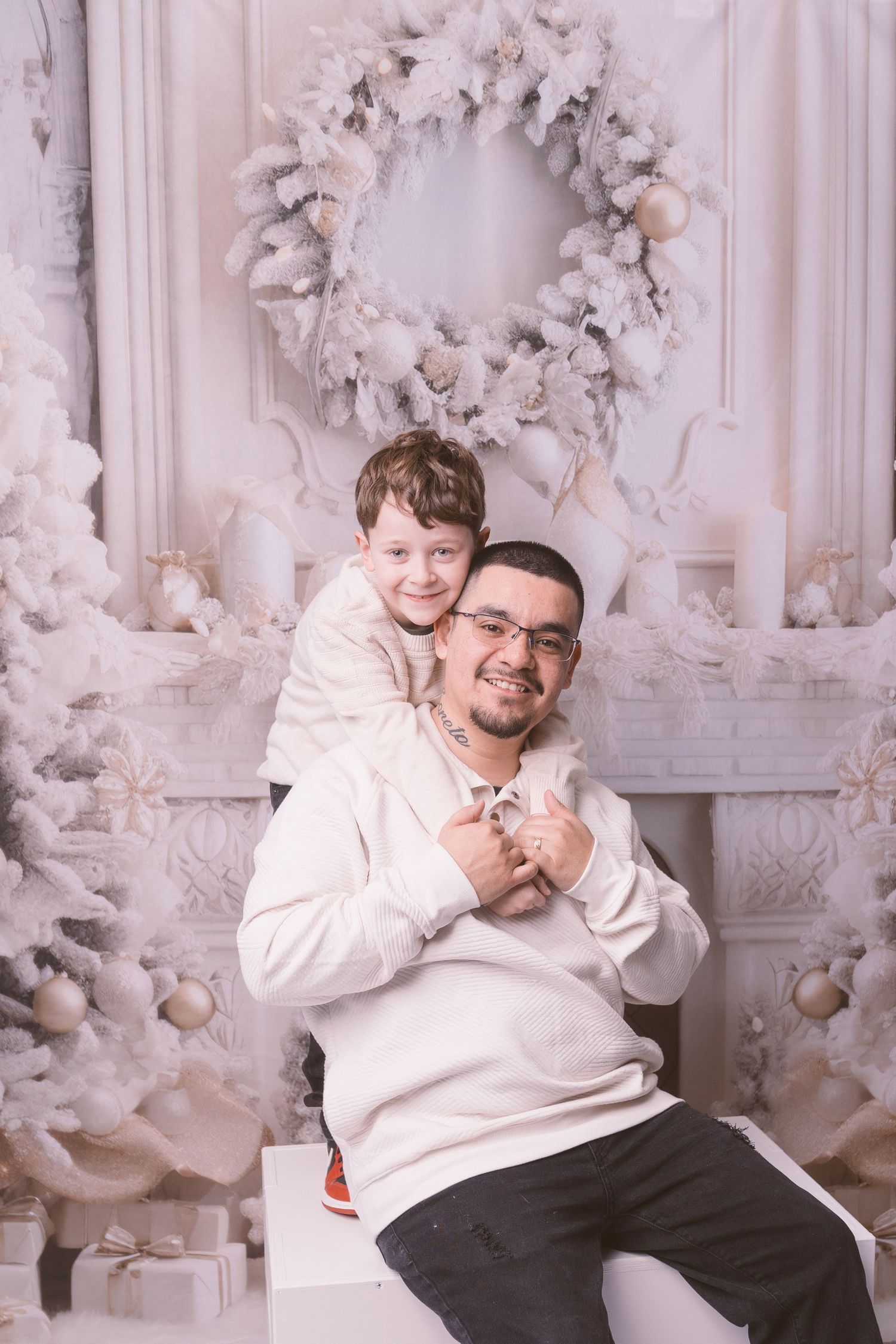 Candid moment captured during winter photo shoot with festive white decor.