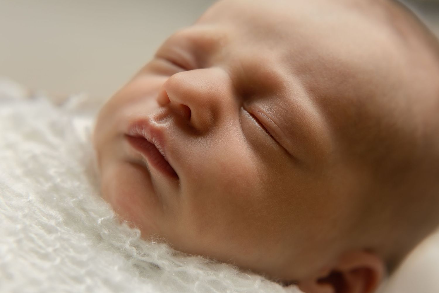 Harrisonburg photographer, newborn, family, maternity, detail shot of sleeping, wrapped baby girl, showing lips, nose, and eyelashes.