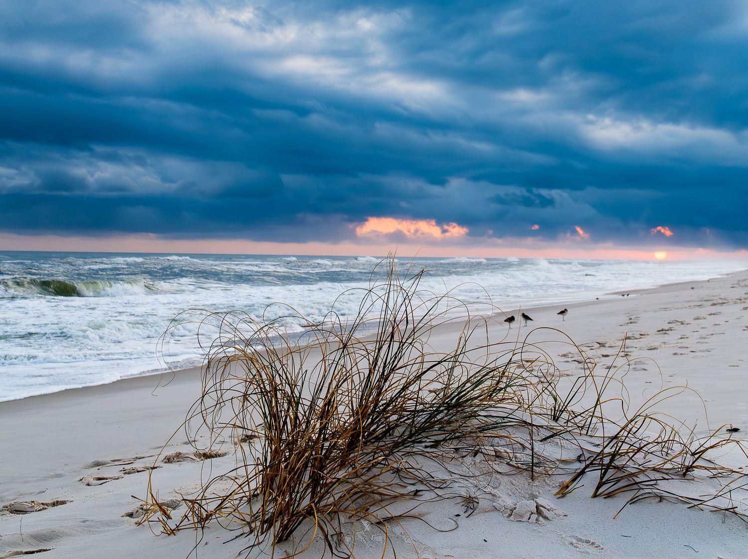 Sunset along beach horizon