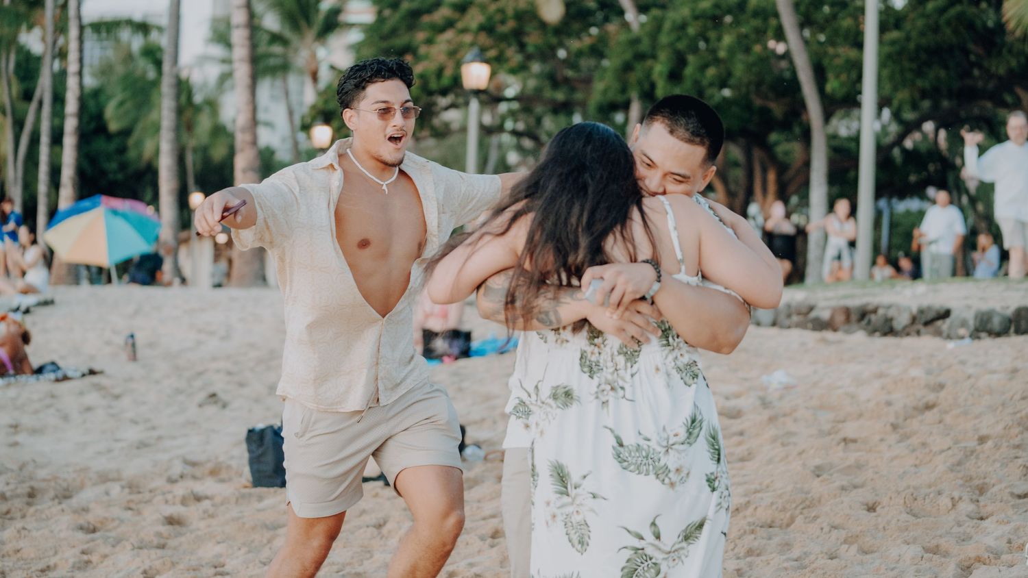 Joyful celebration moment on a sandy beach.