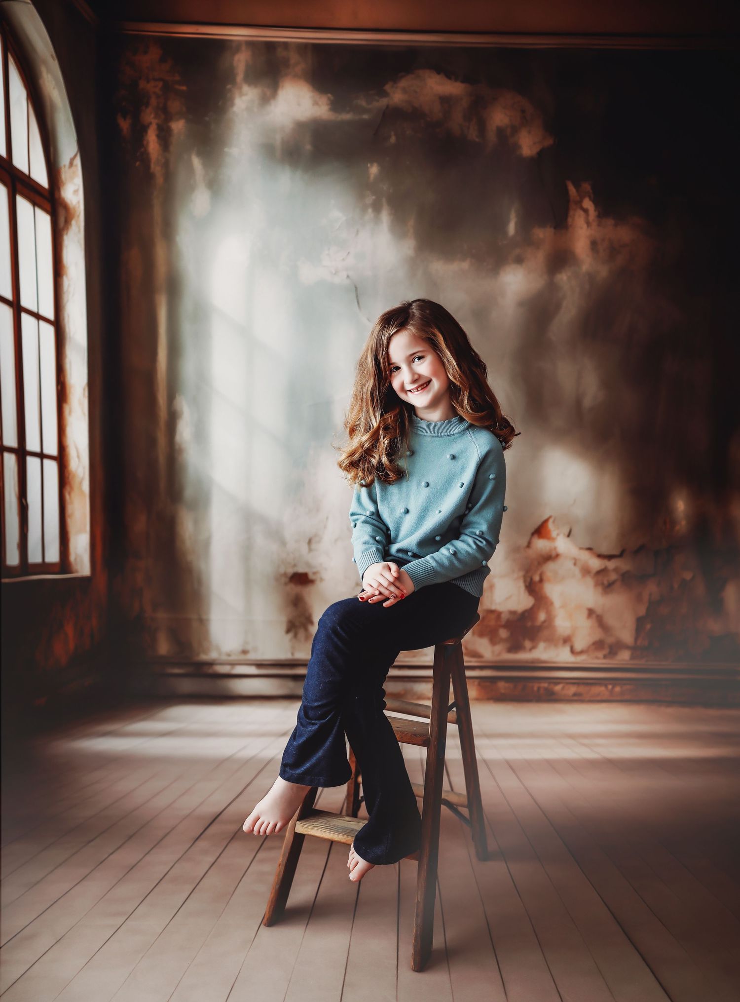 child in chair with mystical background smiling up at camera
Best child photographer, Peoria, IL.