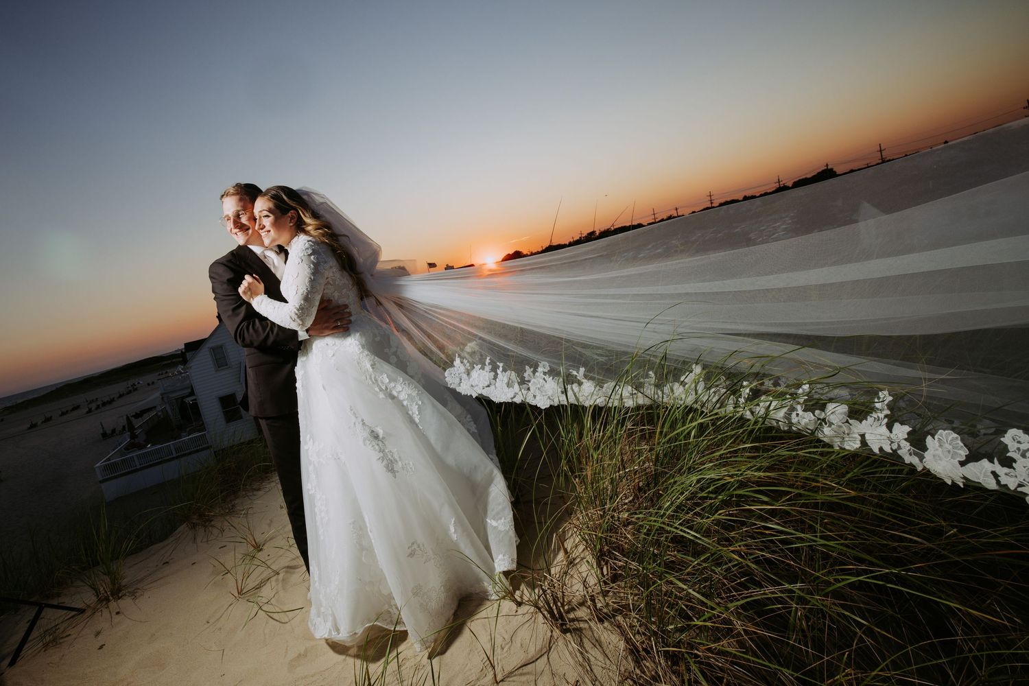Luxurious wedding venue decorated with white floral arches and romantic lighting.