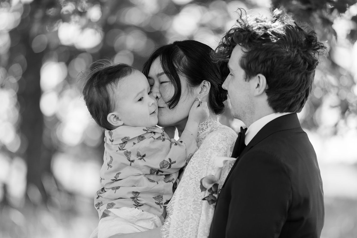A black and white collage of intimate romantic moments showing couples kissing in various outdoor settings.