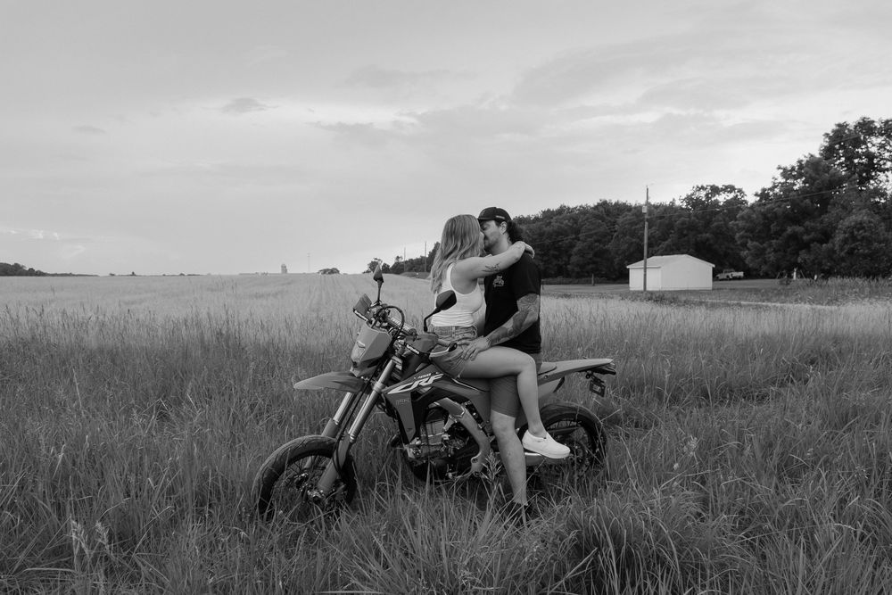 A collection of black and white photographs showing a person lying in tall grass fields at different angles.