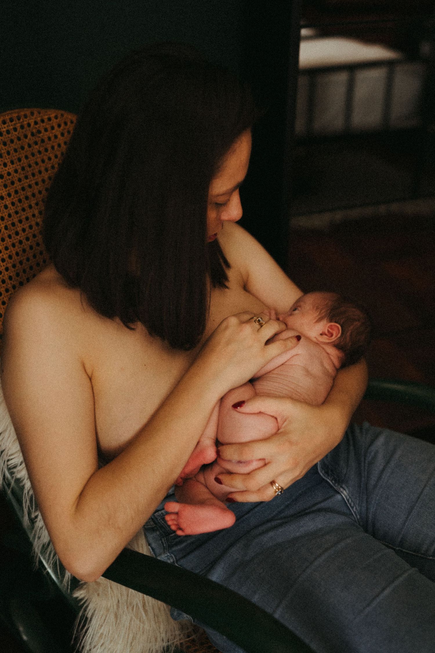 Intimate portrait series captured in moody lighting showing tender moments.