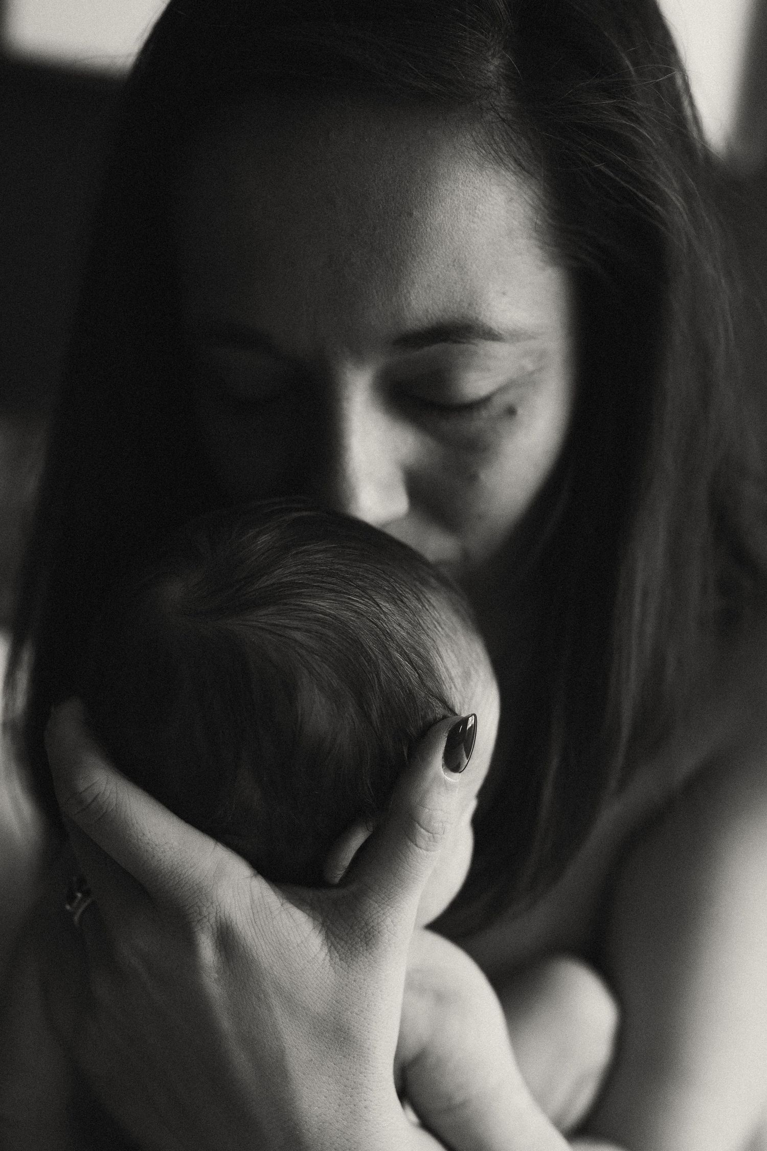 Artistic black and white close-up portrait showing emotional expression.
