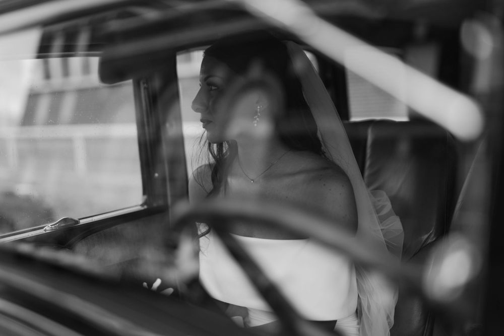 Black and white sequence of a couple in a car on their wedding day.