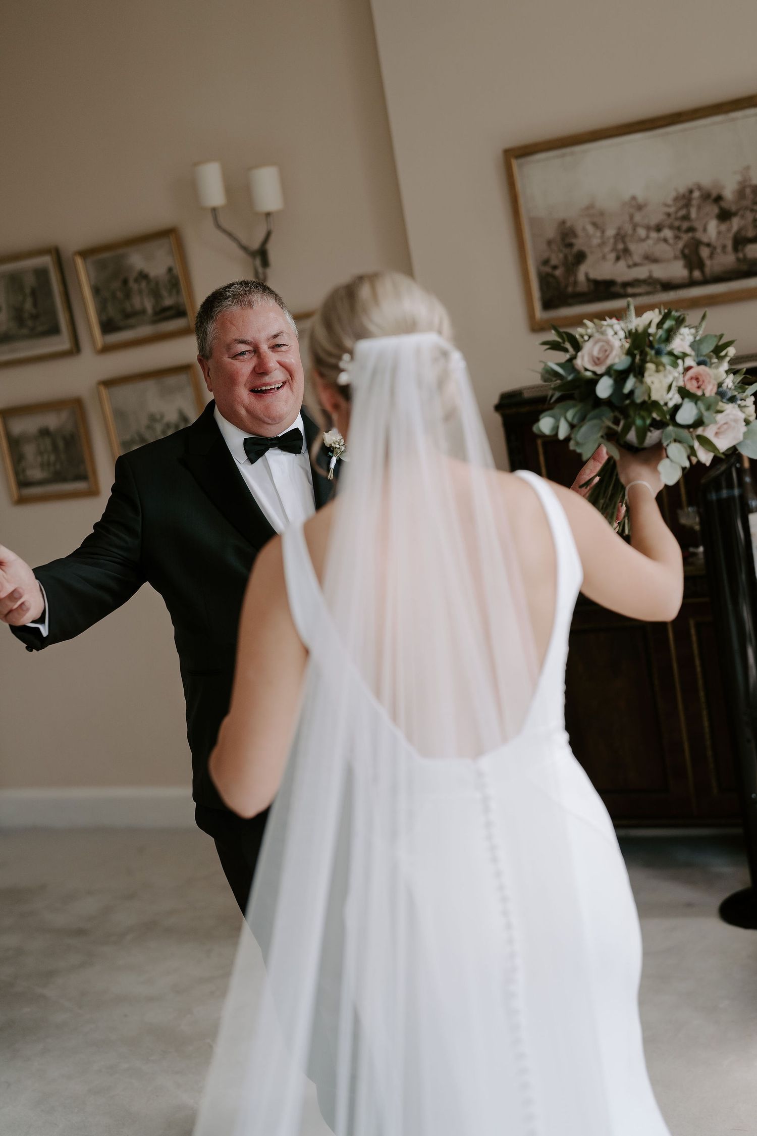 father of bride seeing bride for the first time in her wedding dress at Iscoyd park
