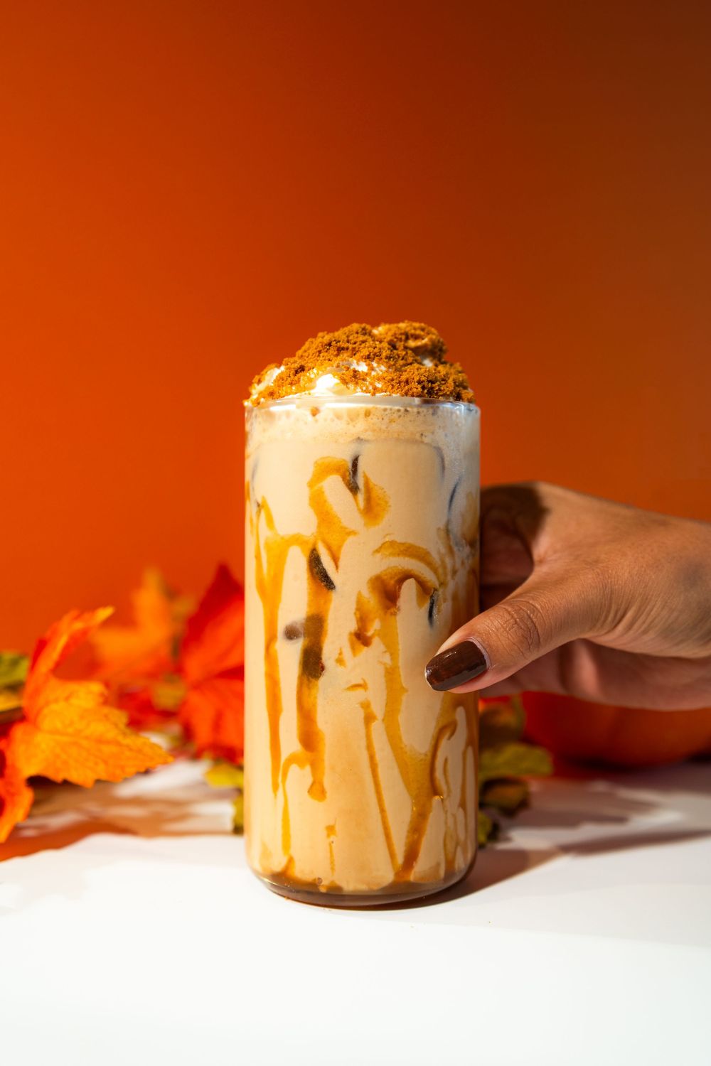 Creamy whipped peanut butter drips down the sides of a glass jar in a series of appetizing action shots.