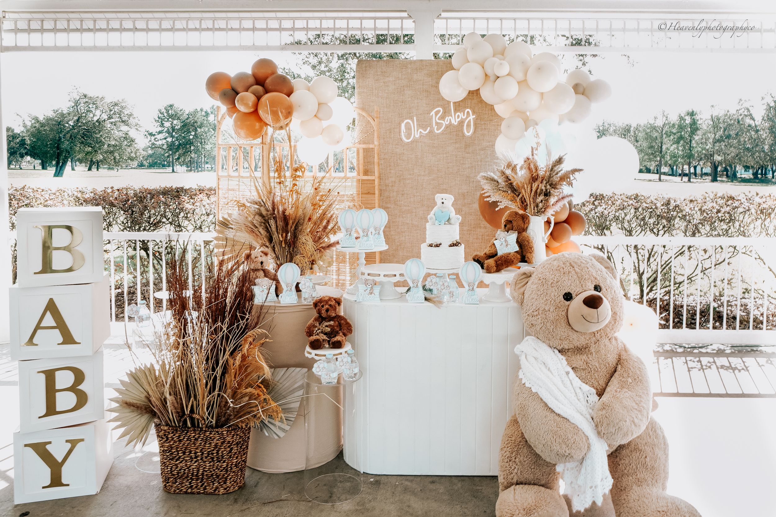 Rustic boho party decorations with letters and dried flowers.