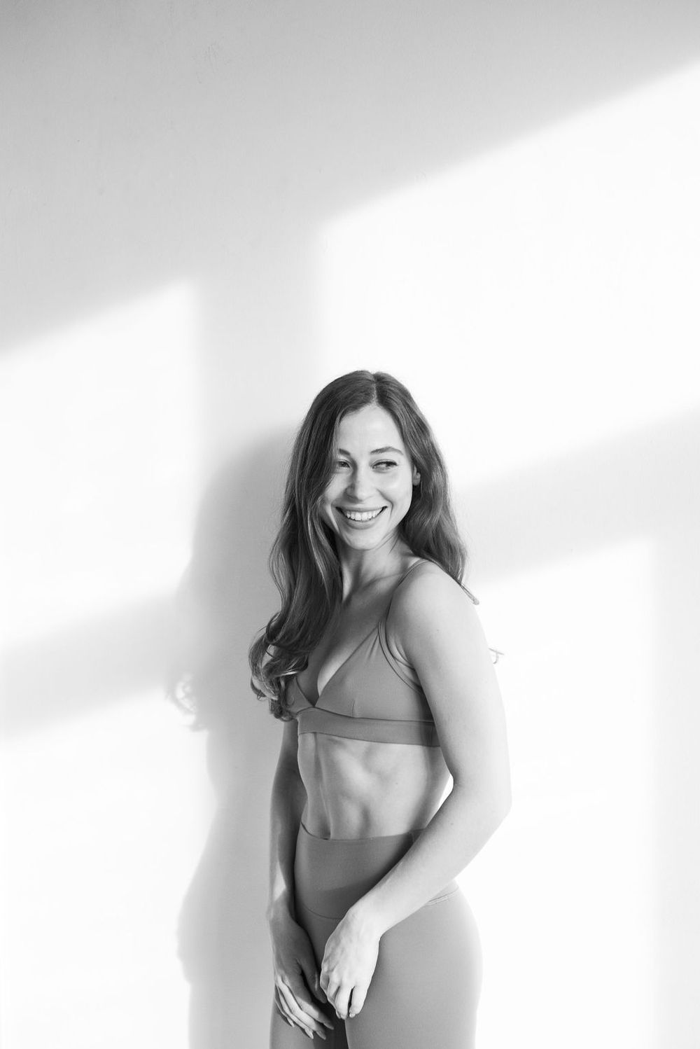 Minimalist black and white portrait series showing natural movement and authentic expressions.