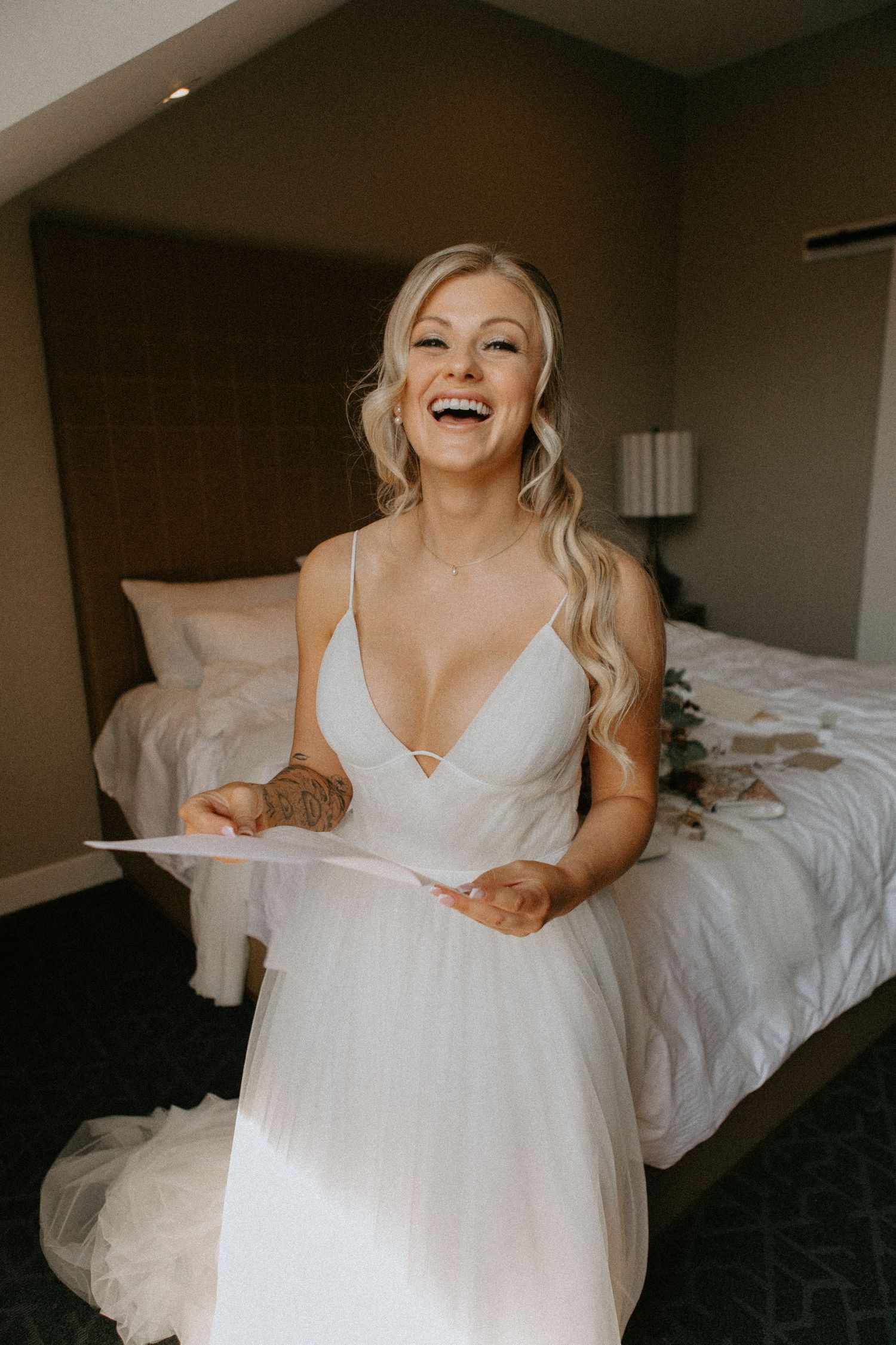 A joyful moment captured of someone in a white wedding dress.