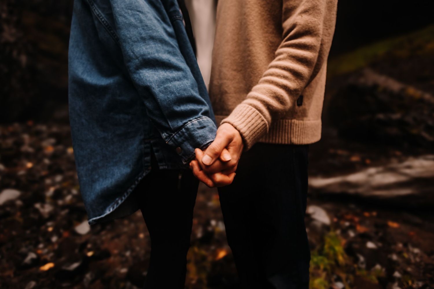Houston photographer that travels to capture moments like this couple by a waterfall in Oregon.