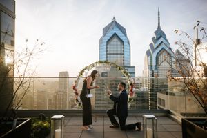 Romantic rooftop proposal at The W Hotel in Philadelphia with skyline views—perfect moment captured in South Asian engagement photography.